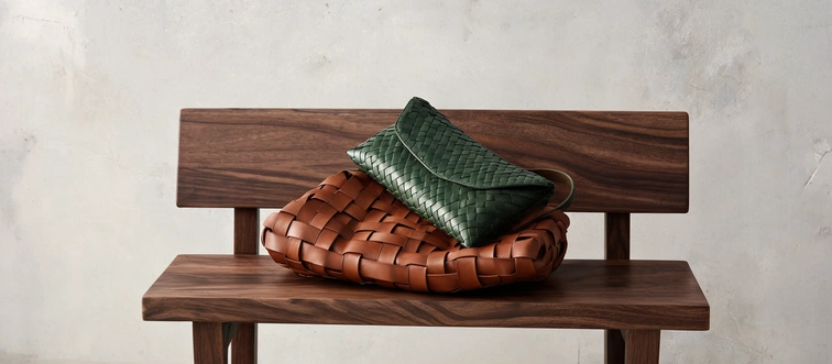 Spot the brand known for the iconic Intrecciato leather weaving technique.
