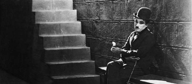 This silent-era icon defined early cinema style with his signature 'tramp' look. Can you place him?
