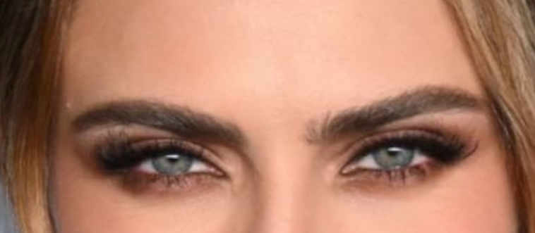 Let's start with a gaze-framing detail: whose signature, bold eyebrow is this?