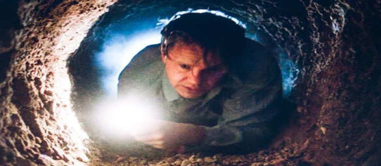 Imagine a slow-burn prison escape drama reframed as a decades-long renovation project ending in an incredibly messy, subterranean exit. Which cinematic masterpiece features this grueling journey?