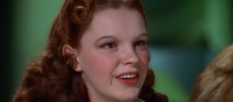 An iconic blue gingham dress and a pair of ruby slippers define this beloved character. Which legendary production features Dorothy Gale?