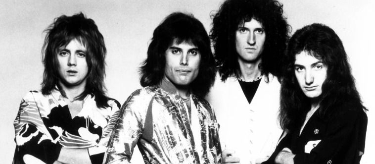 Imagine a stage defined by ultimate theatricality, anchored by the incomparable Freddie Mercury. Which legendary outfit claimed this signature spotlight?